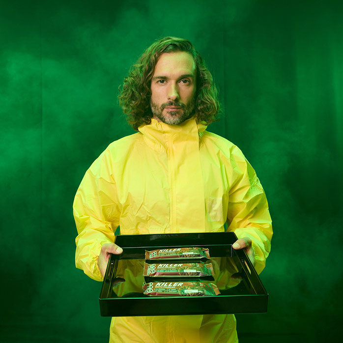 Joe with tray of Killer Bars on green smoke background